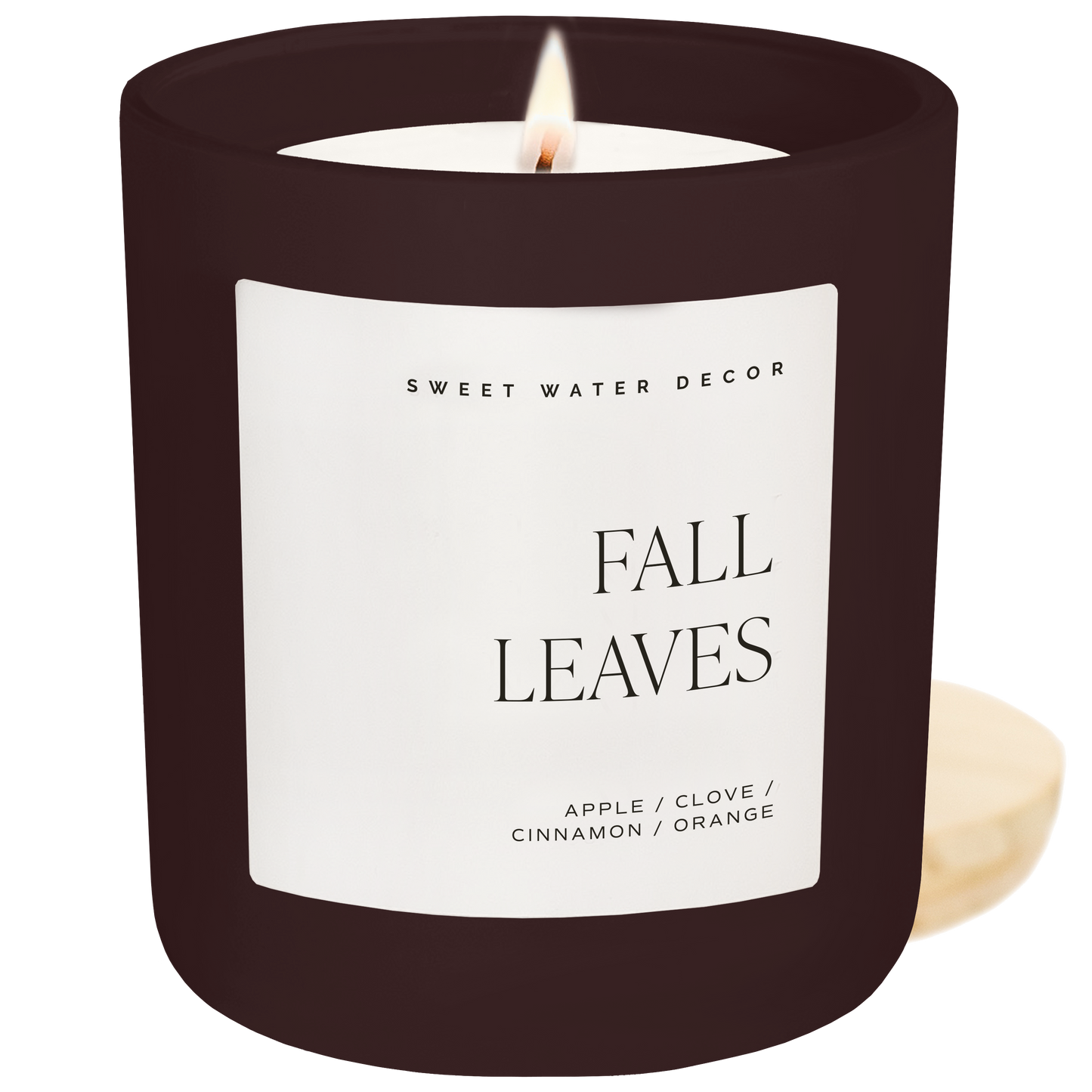 Candle with 'Fall Leaves' label and 'Sweet Water Decor' branding on a white background