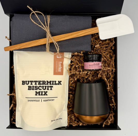 Gift set with buttermilk biscuit mix, black mug, and other items in a box.