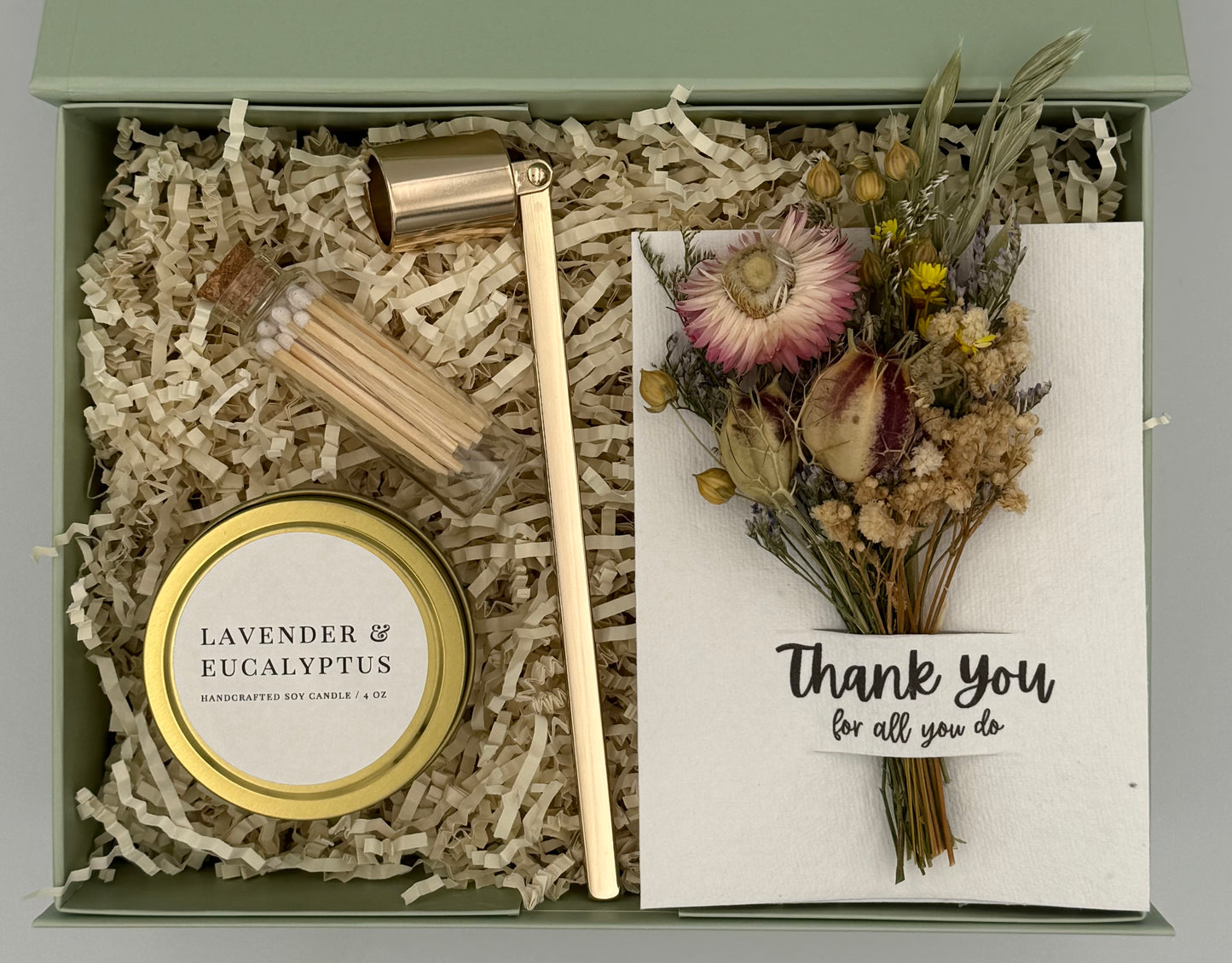 Gift set with candle, wooden mallet, and card in a box