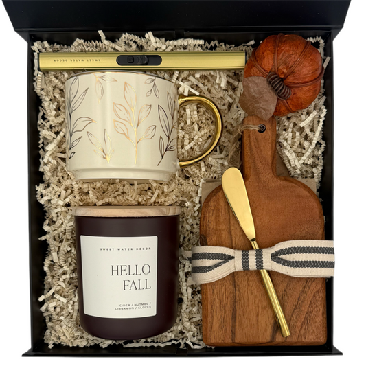 Gift set with mug, candle, and wooden cutting board in a box