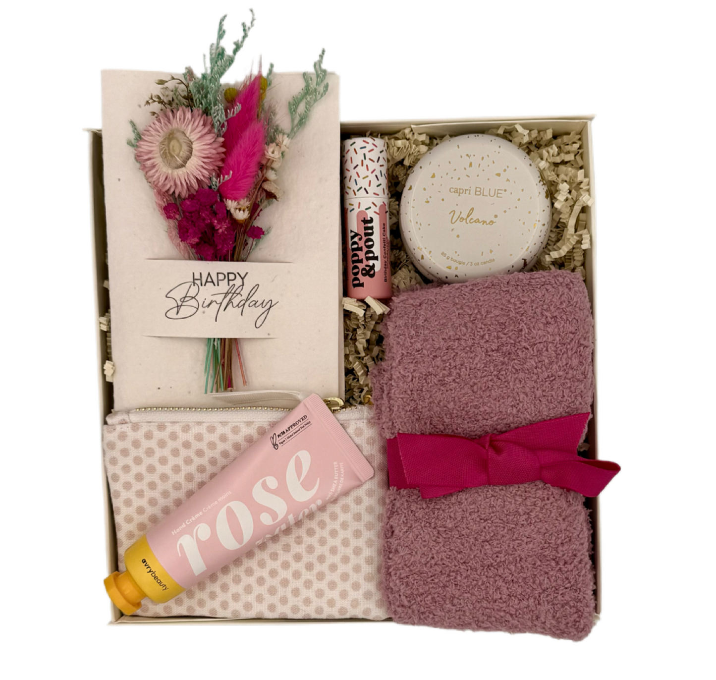 Gift set with bath items including a bottle, soap, and towel in a box.