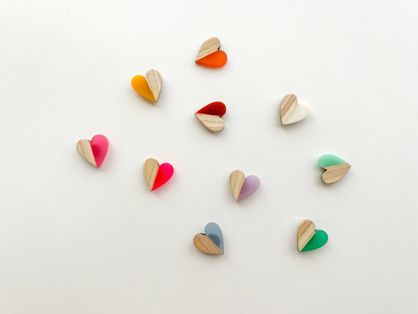 Colorful heart-shaped objects on a light background