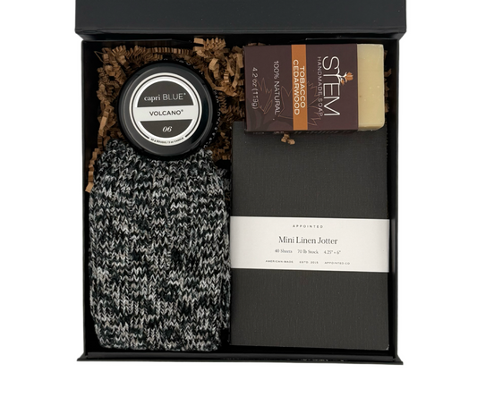 Gift set with a jar, socks and other items in a black box