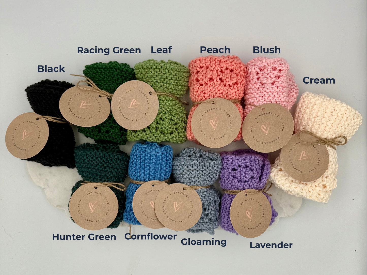 Assorted crochet squares in various colors with labeled tags on a light gray background