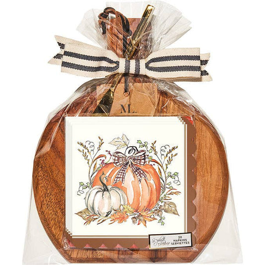 Wooden tray with a decorative card featuring pumpkins and leaves, tied with a ribbon, on a white background.