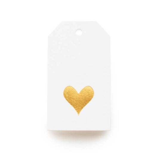 White gift tag with a gold heart on a white background