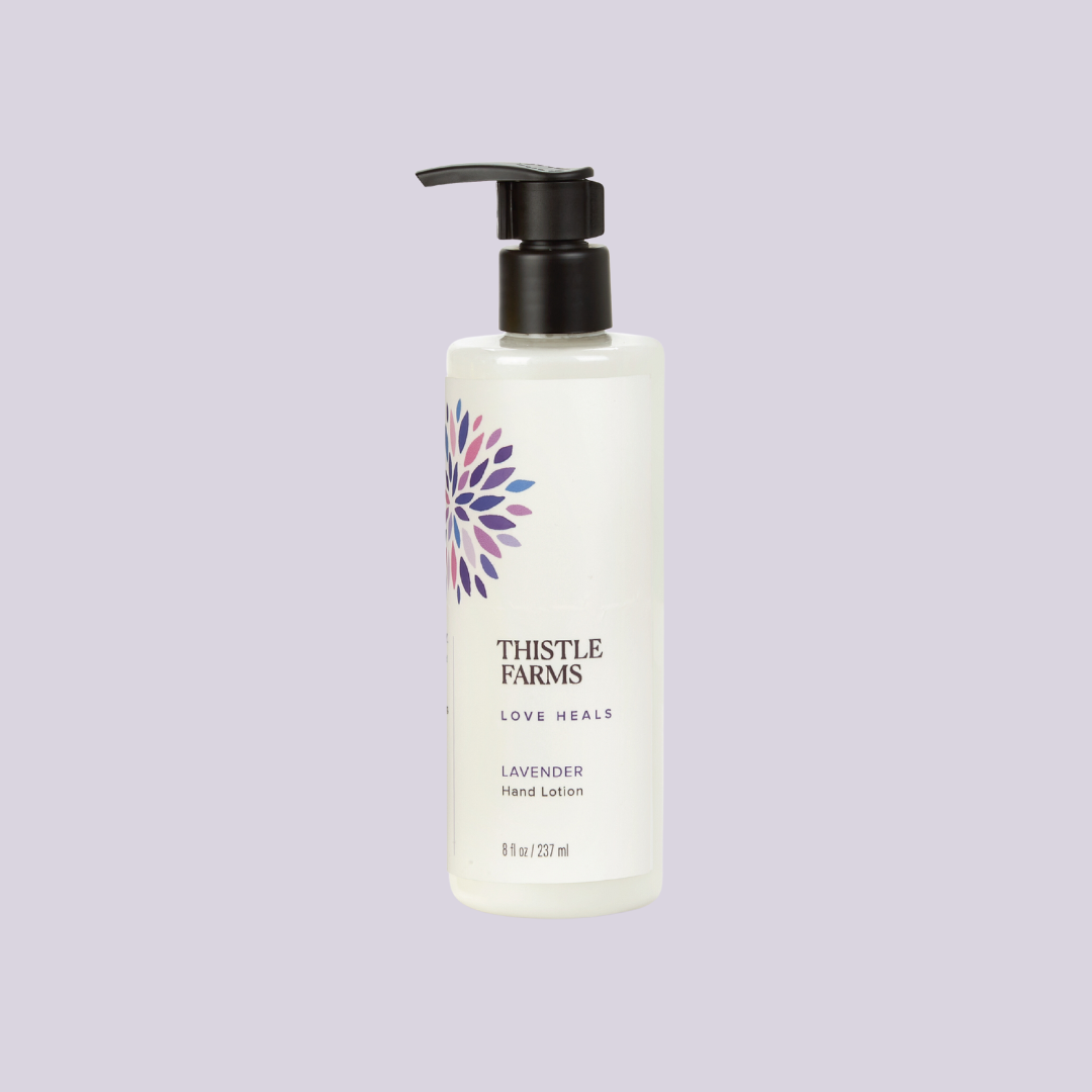 Thistle Farms lavender hand lotion bottle on a light purple background