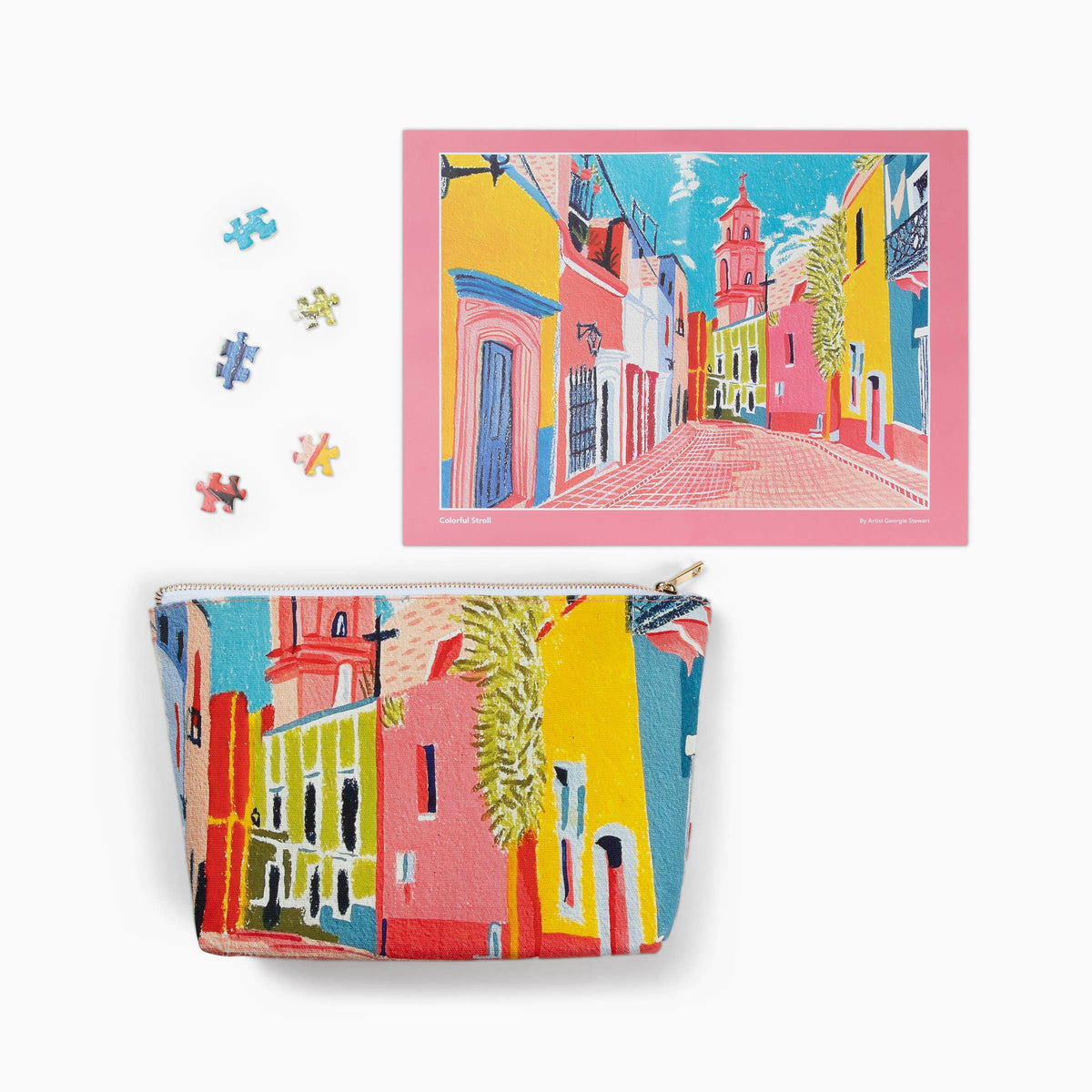 Colorful street scene print on a pouch and puzzle pieces with a matching poster.