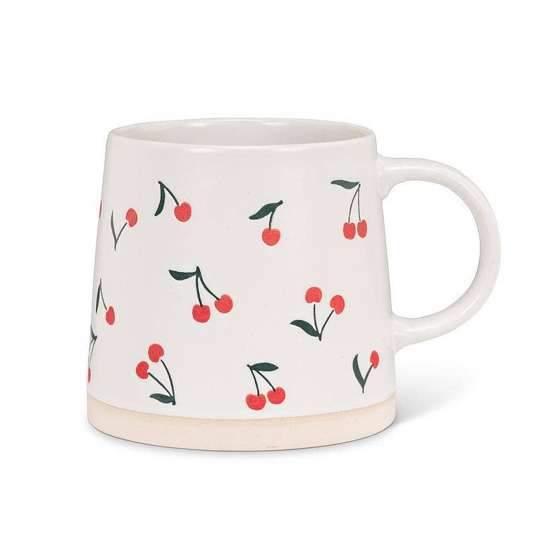 White mug with cherry pattern on a white background