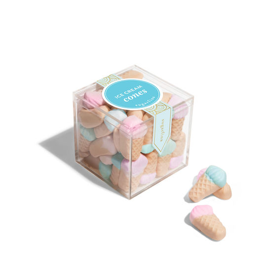 Box of marshmallow ice cream cone candies with a clear lid on a white background