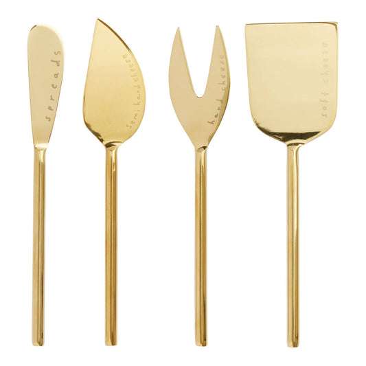 Set of four gold cheese knives on a white background