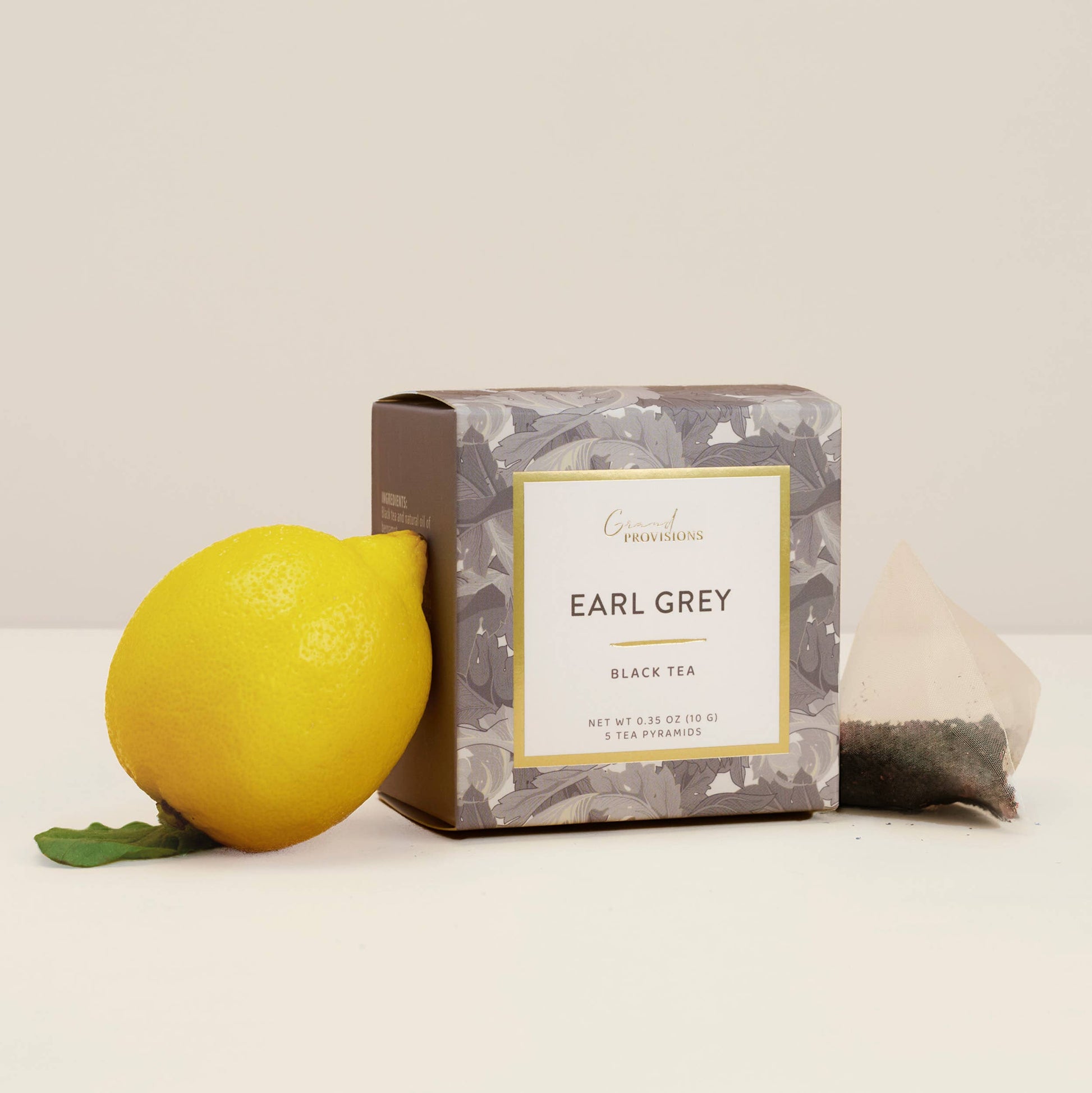 Earl Grey black tea package with a lemon on a white background