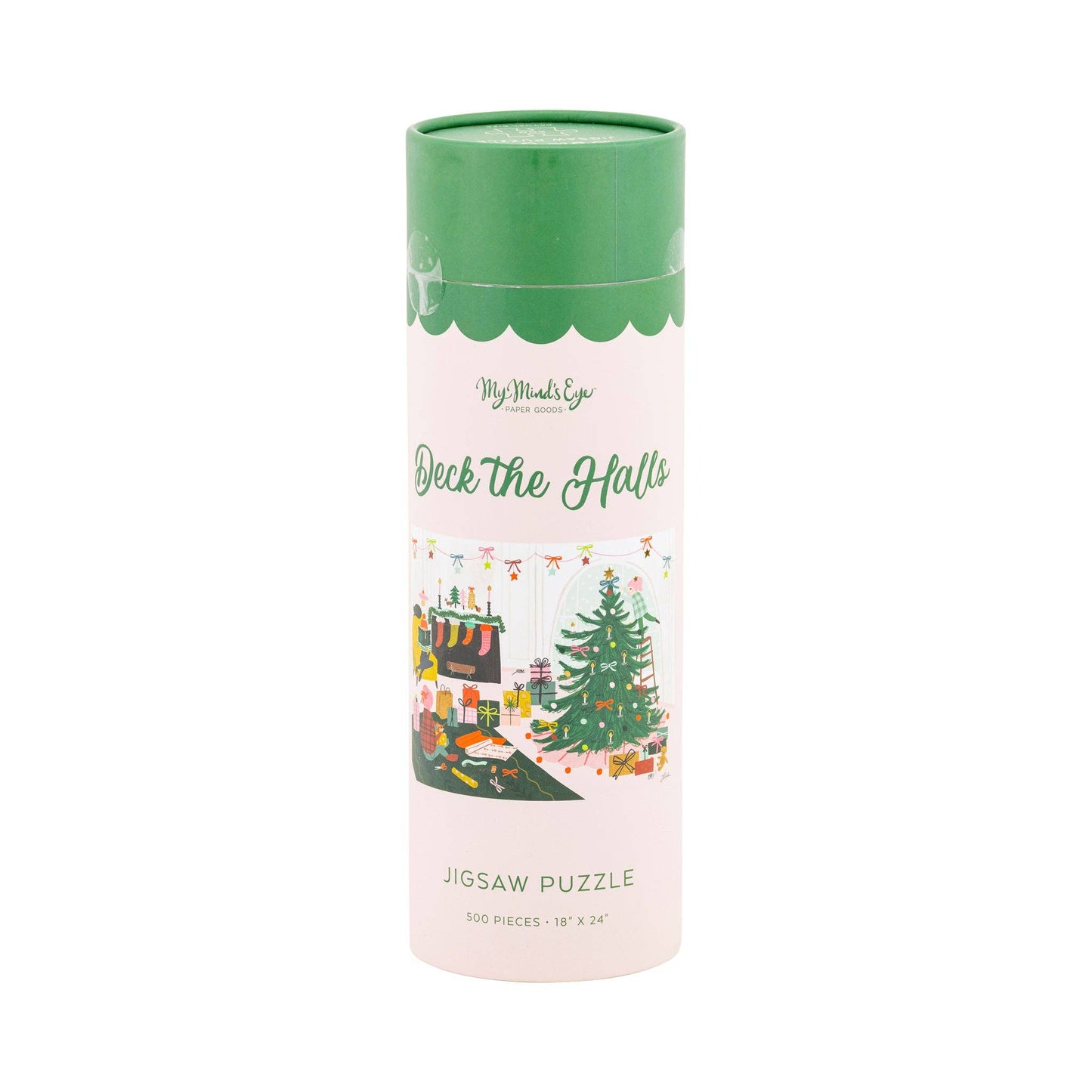 A cylindrical cardboard tube package for a jigsaw puzzle, with a light pink body, green lid, and a central holiday illustration showing a decorated Christmas tree, gifts, and a table setting. The text reads 'My Mind's Eye', 'Deck the Halls', and 'Jigsaw Puzzle'.