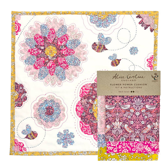 Floral patterned cushion cover with packaging and label on a white background