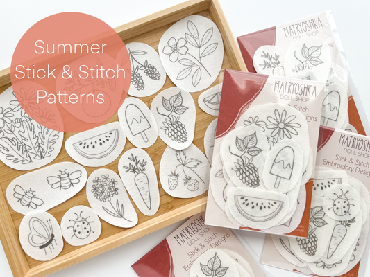 Set of summer-themed stick and stitch patterns on a wooden tray with 'Matryoshka Doll' branding.