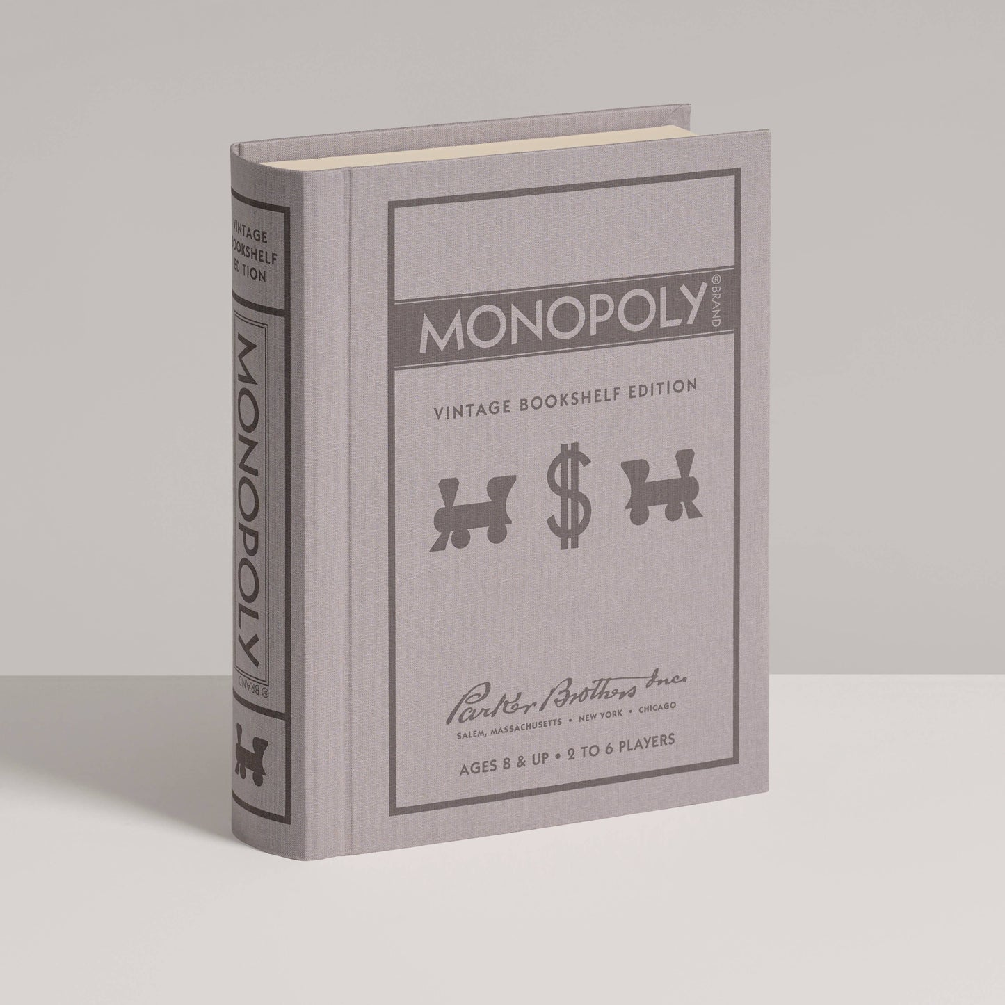 Monopoly vintage bookshelf edition packaging on a gray background