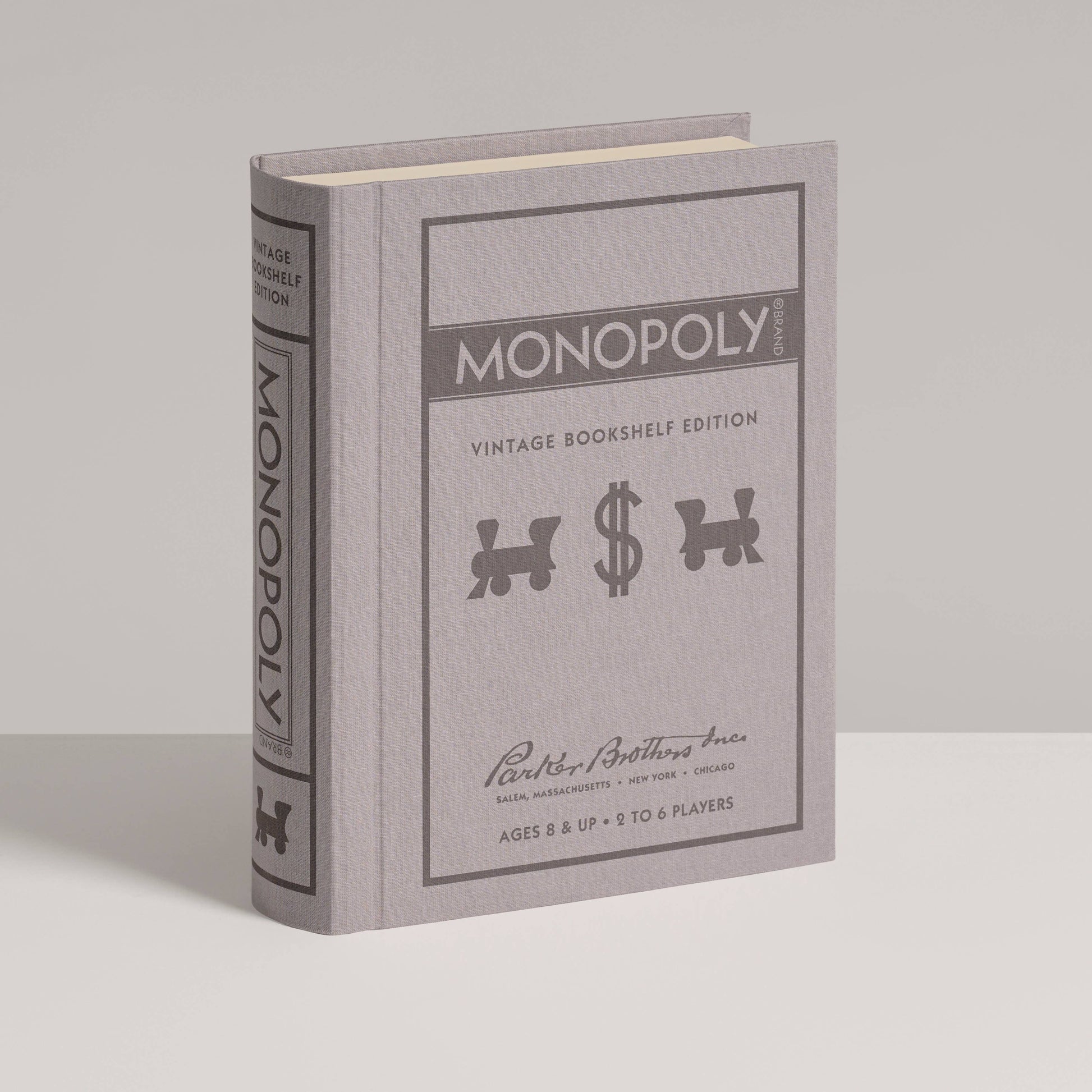 Monopoly vintage bookshelf edition packaging on a gray background