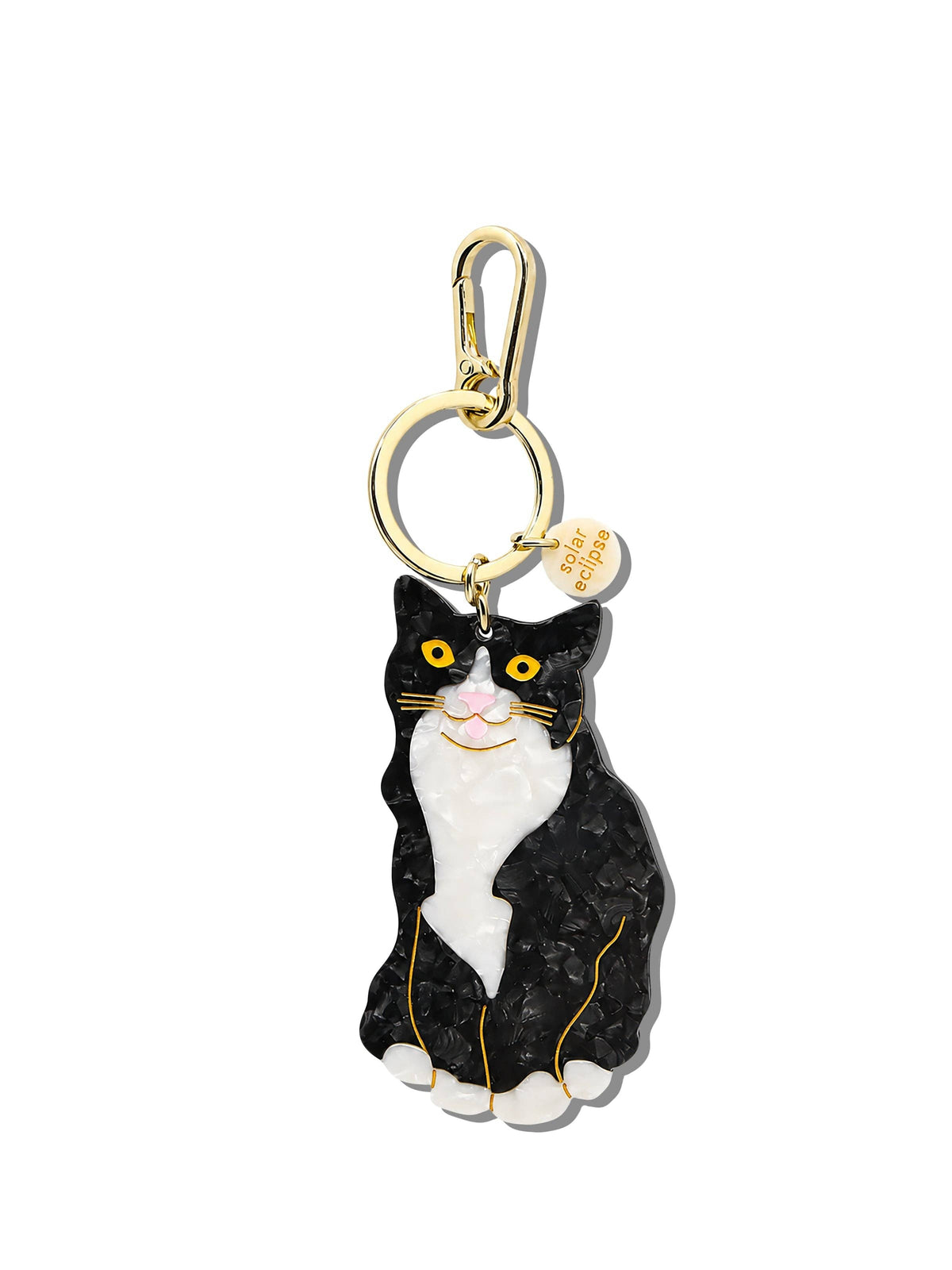 Cat-shaped keychain with a gold clasp on a white background
