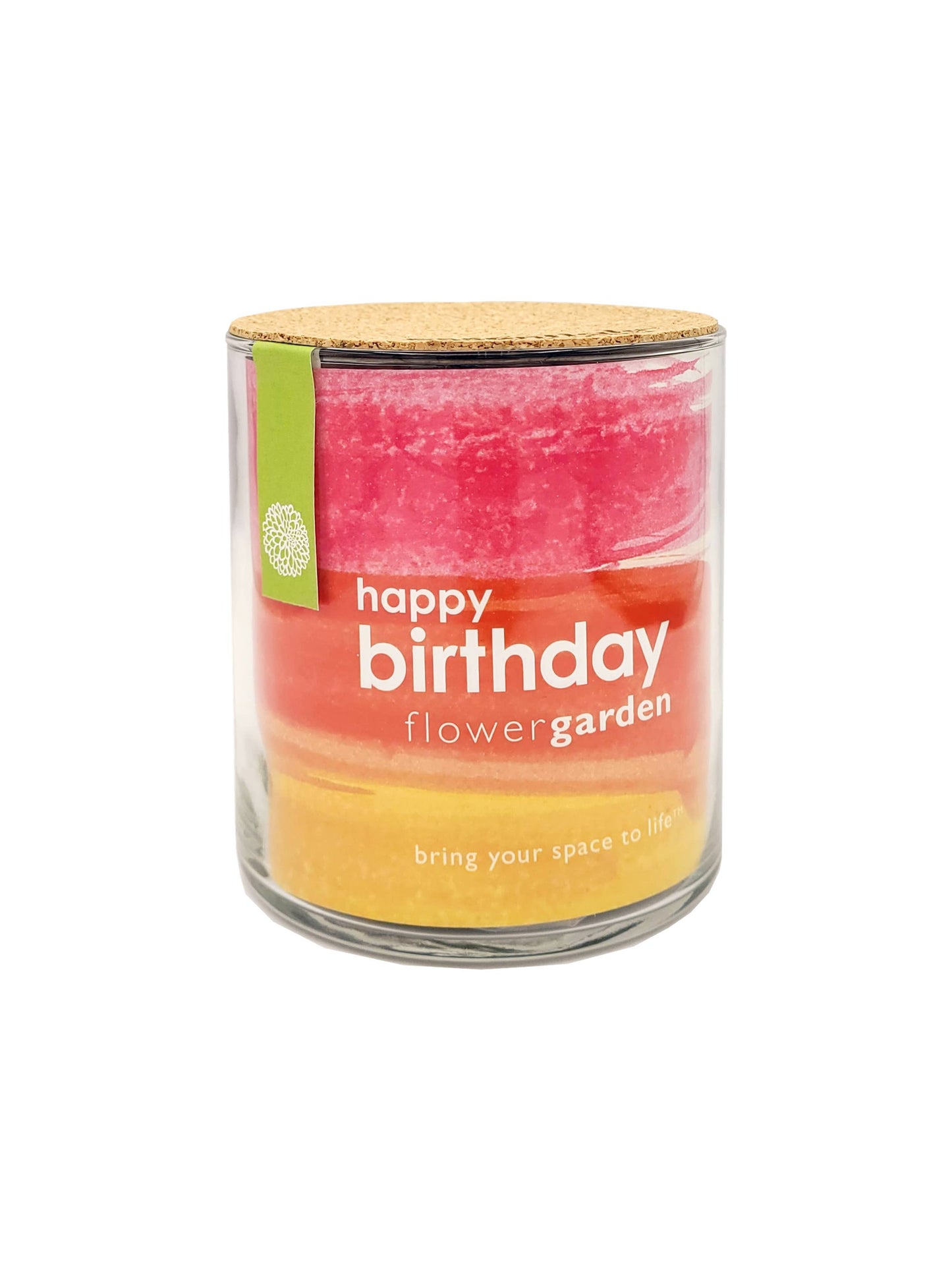 Candle in a glass jar with a colorful label reading 'happy birthday flower garden' on a white background.