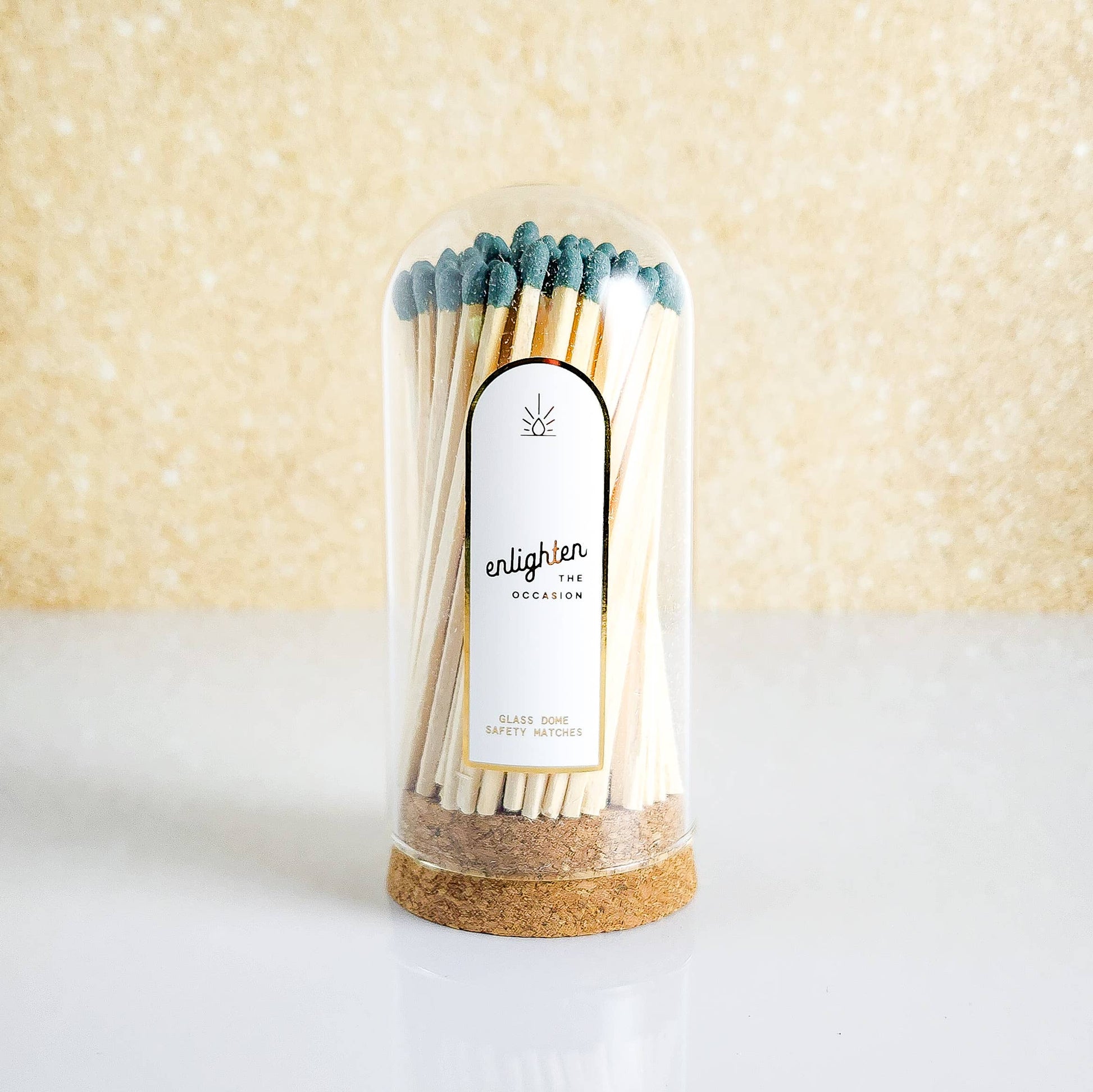 Pack of matches with cork base and glass cover on a light background