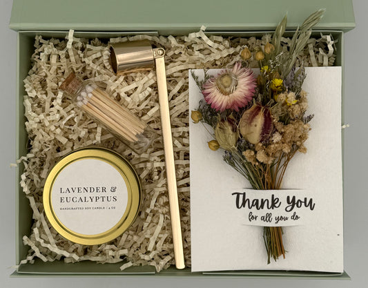 Gift set with candle, wooden mallet, and card in a box