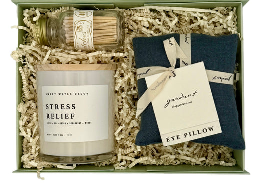 Gift set with 'Stress Relief' candle, 'Eye Pillow', and matchbox in a box.