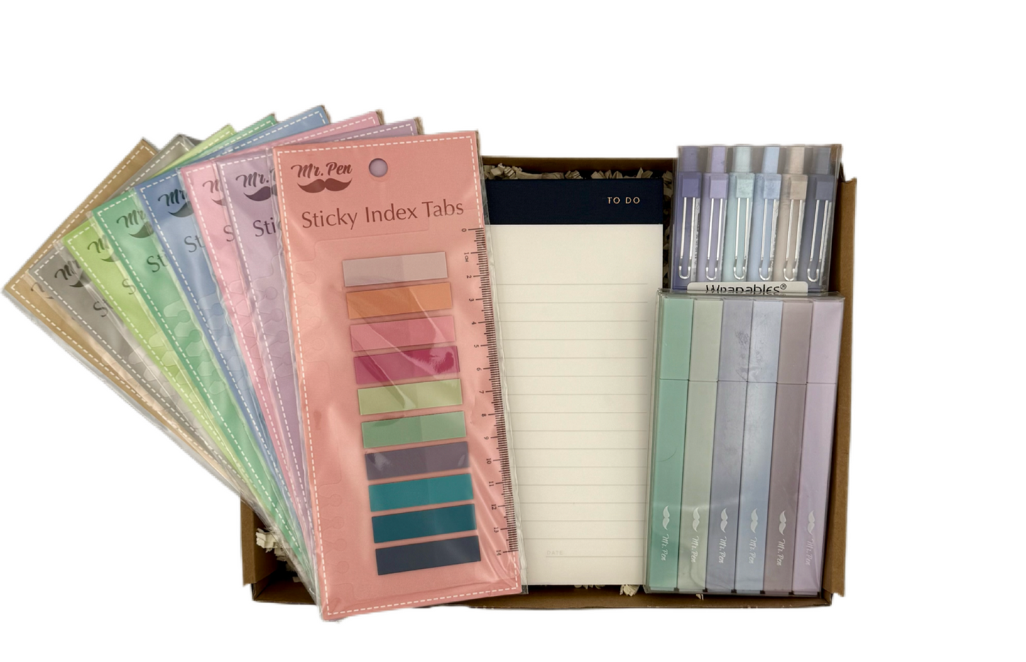 Set of colorful sticky index tabs in a box on a white background