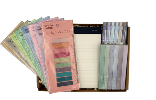 Set of colorful sticky index tabs in a box on a white background
