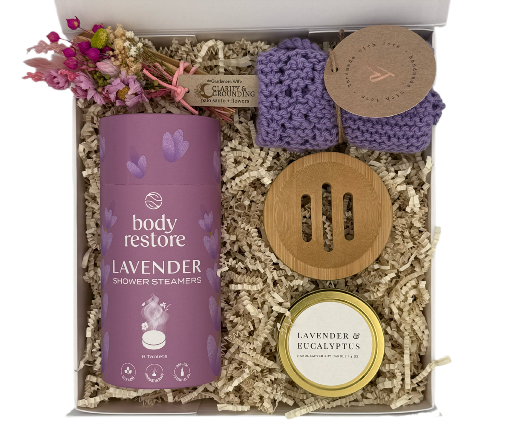 Gift set with lavender-themed products including a canister, soap, and candle in a box.