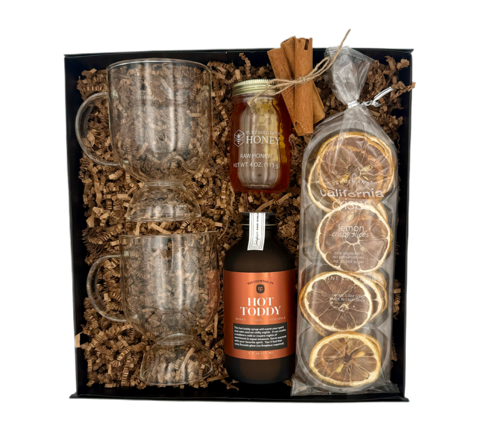 Hot toddy gift set with glasses, honey, and dried oranges in a box.