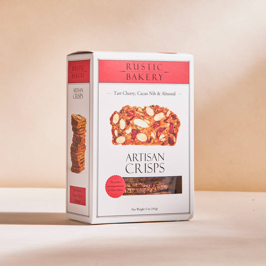 Box of Rustic Bakery Artisan Crisps on a beige background