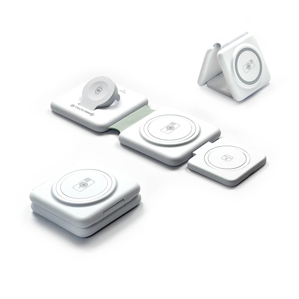 Set of five white wireless charging pads on a white background