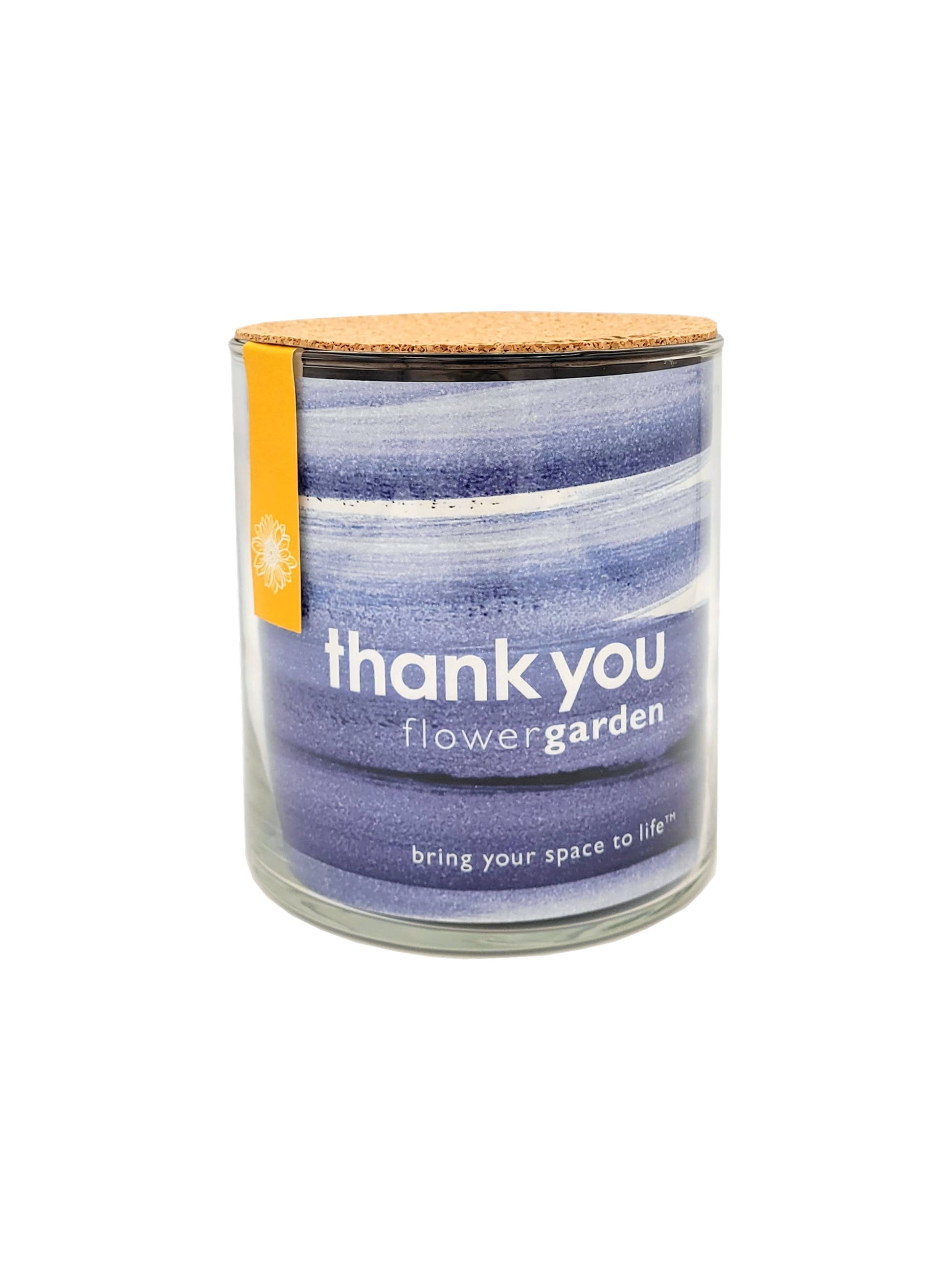 Candle in a glass jar with a striped label on a white background