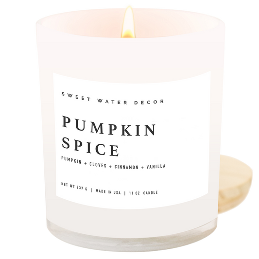 Candle labeled 'Pumpkin Spice' by Sweet Water Decor on a white background