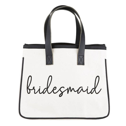 White tote bag with 'bridesmaid' text and black handles on a white background