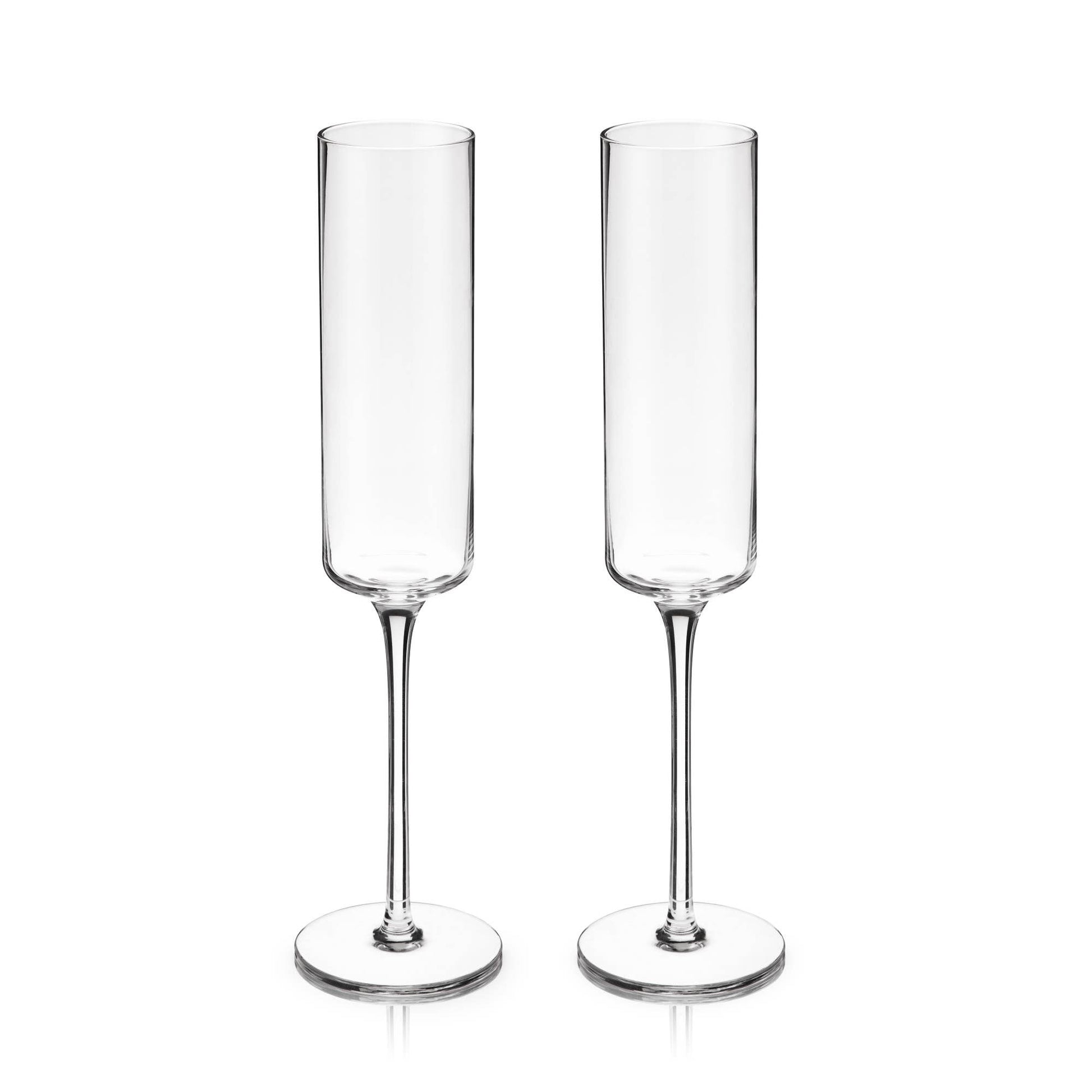 Two clear champagne flutes on a white background