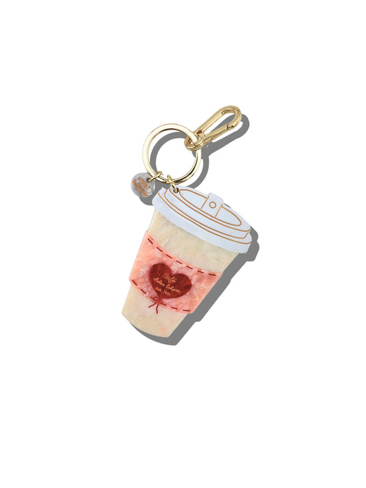 Keychain shaped like a coffee cup with a heart design on a white background