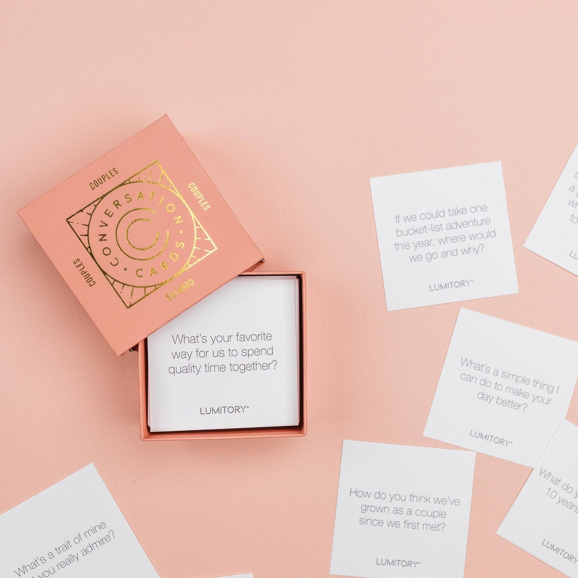Pink box with 'Lumitory' cards on a pink background