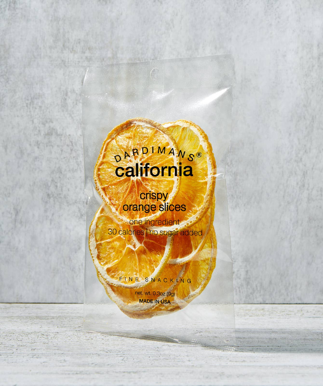 Packaged crispy orange slices with 'Dardimans California' branding on a light gray background