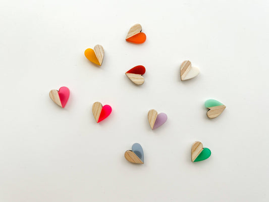 Colorful heart-shaped objects on a light background