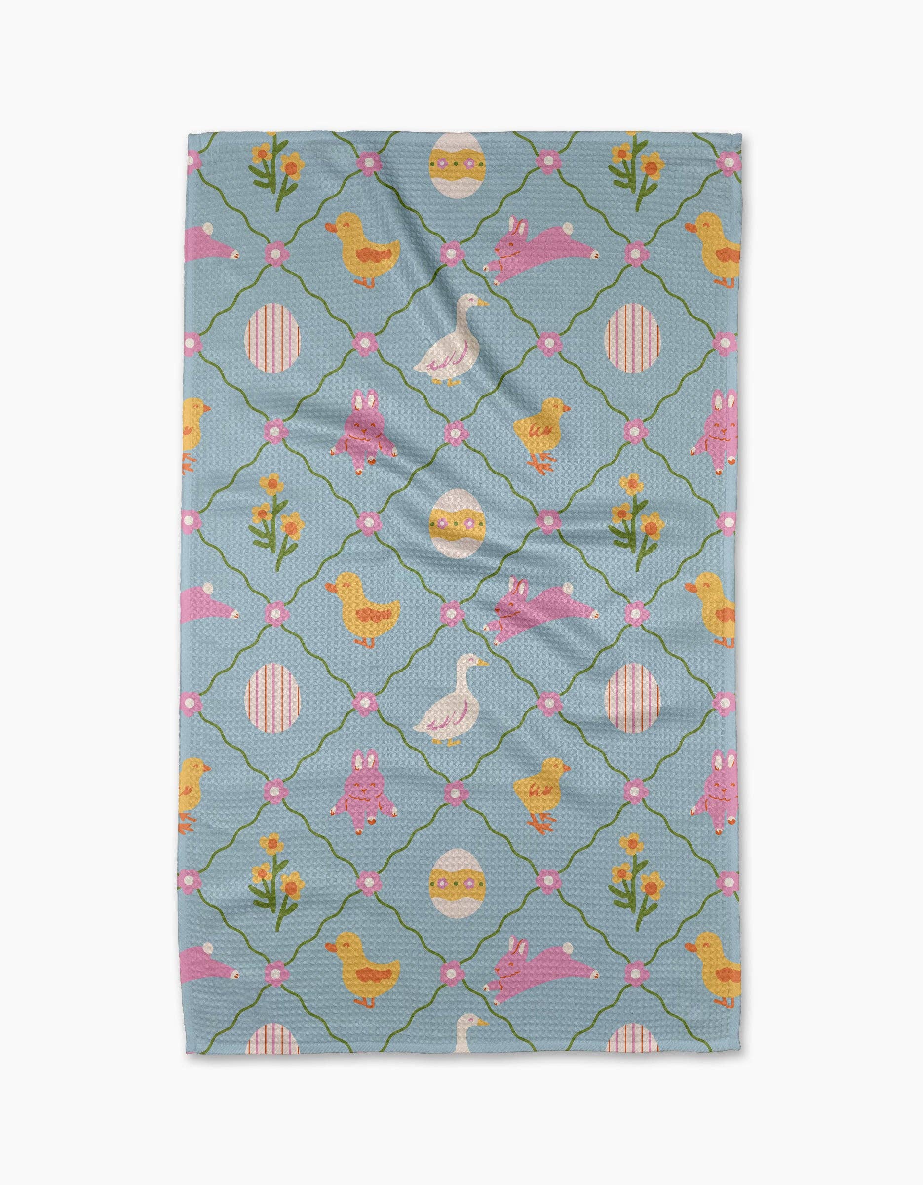 Tea towel with Easter-themed pattern on a white background