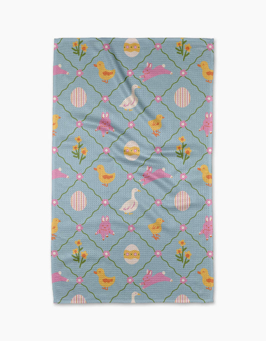 Tea towel with Easter-themed pattern on a white background
