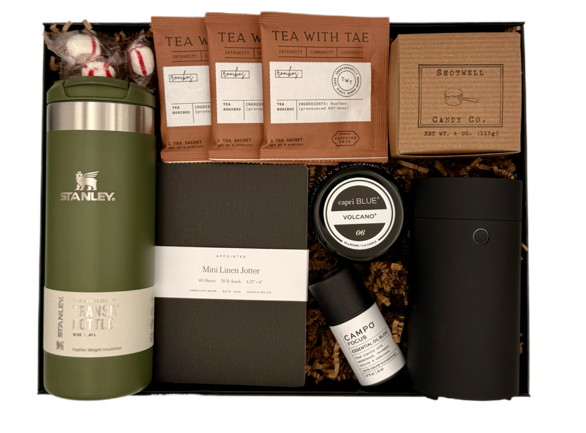 Gift set with Stanley mug, tea packages, and other items in a box