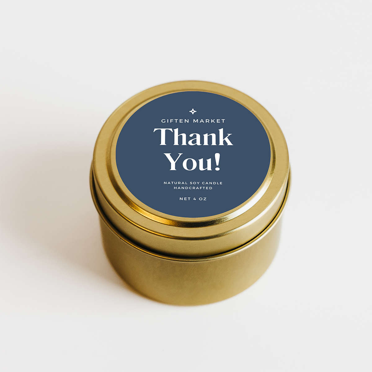 Gold candle tin with 'Thank You!' label on a white background