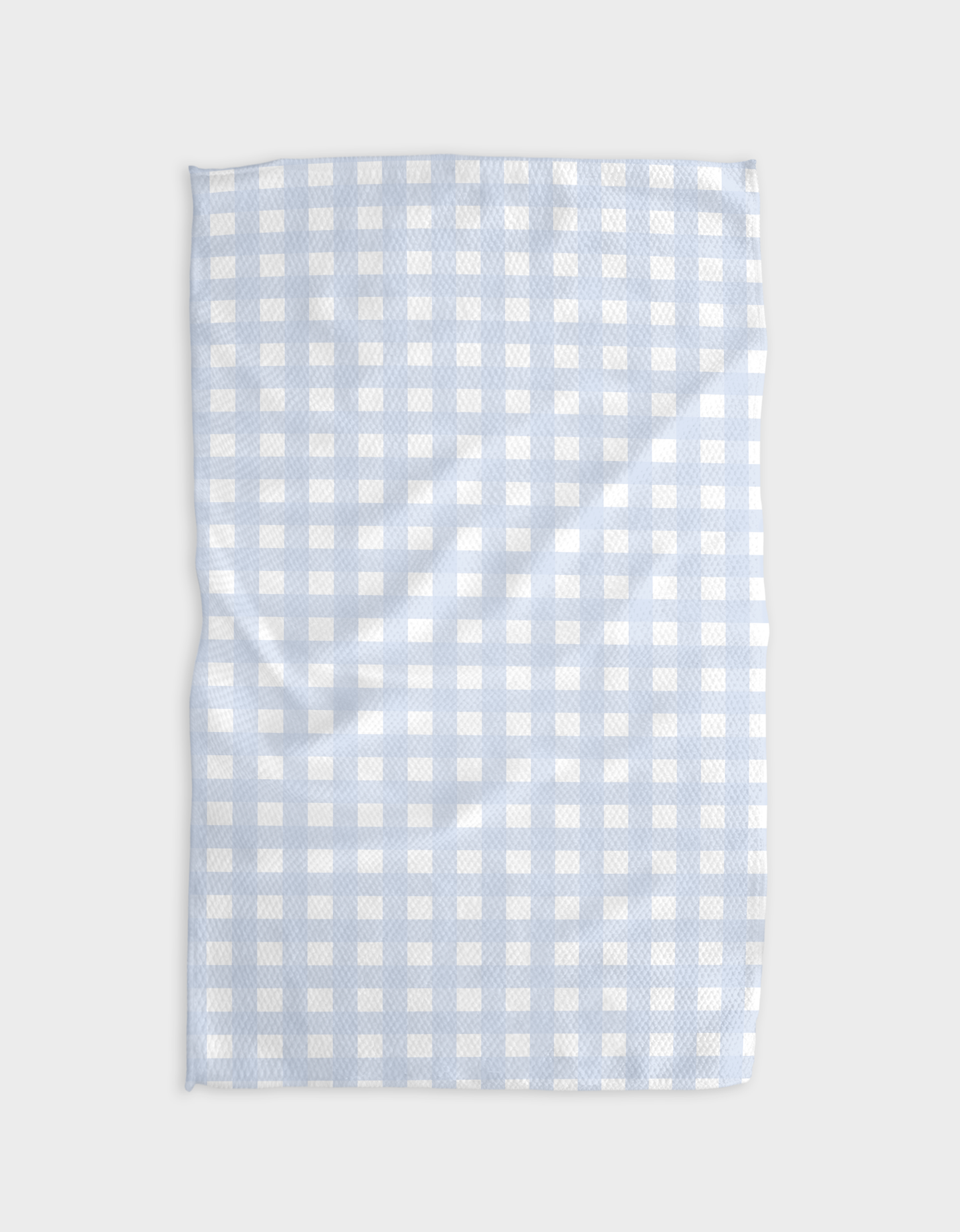 Light blue and white checkered towel on a light gray background