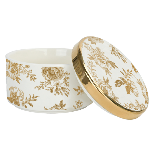 Decorative ceramic container with gold floral patterns on a white background