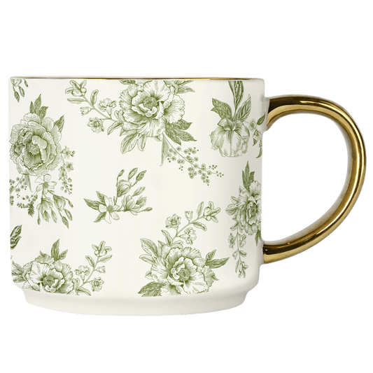 Mug with floral pattern and gold handle on a white background