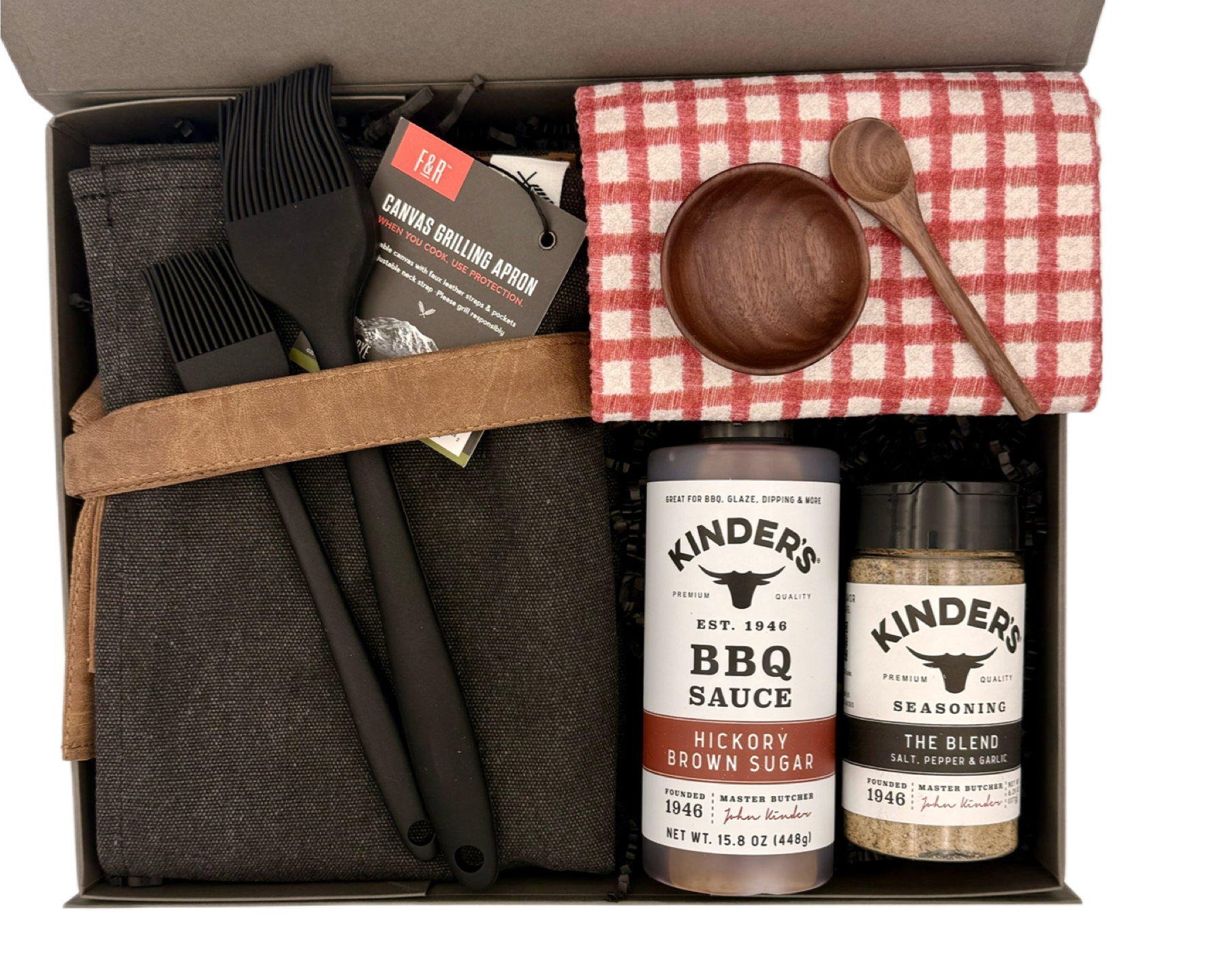Grilling gift set with barbecue tools, sauces, and seasonings in a box.
