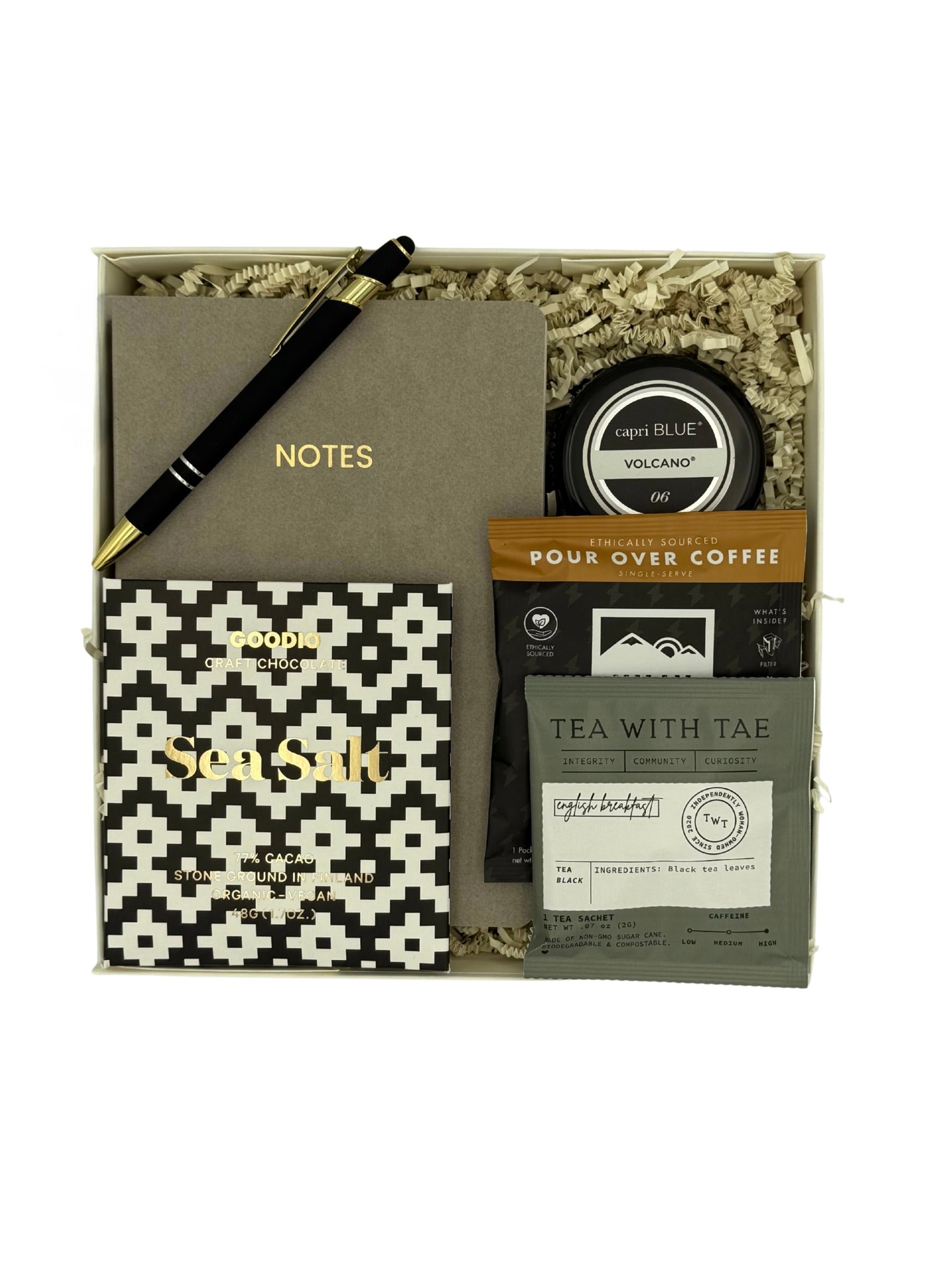Gift set with notebook, pen, and tea packaging in a box