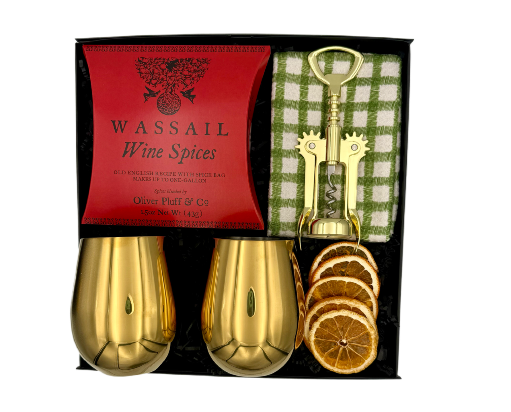 Wassail wine spices set with gold shakers, bottle opener, and dried oranges in a black box.